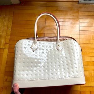 Arcadia patent leather cream handbag